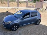 Renault Sandero 2013 годаүшін3 370 000 тг. в Актобе